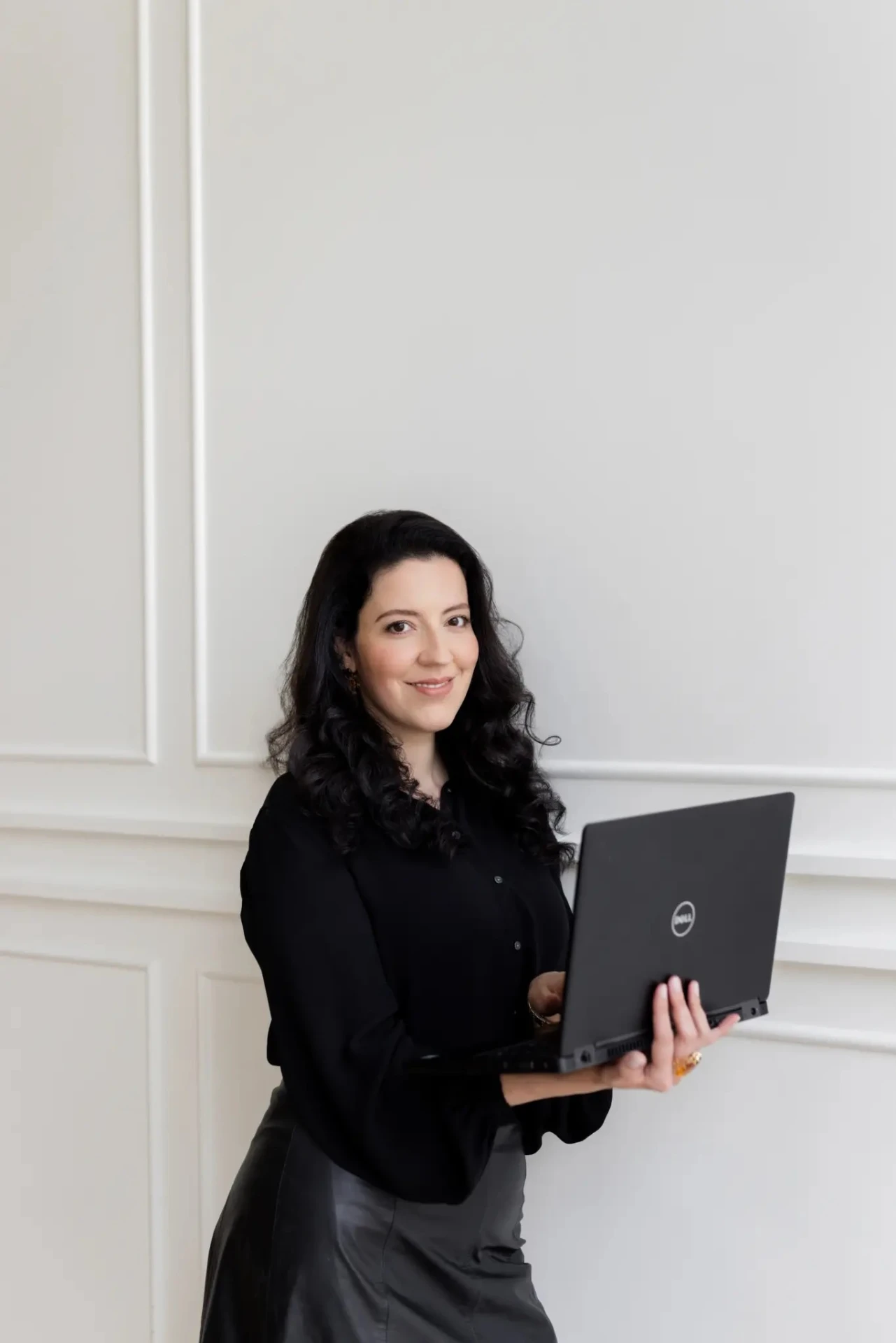 Marianne Lins, fractional marketing strategist, working with a laptop